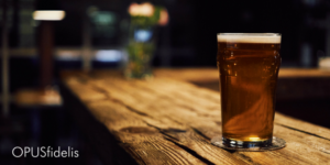 Glass of beer on bar counter