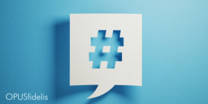 Twitter hashtag in speech bubble against blue background