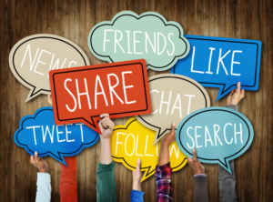 Hands Holding Speech Bubbles with Social Media Words